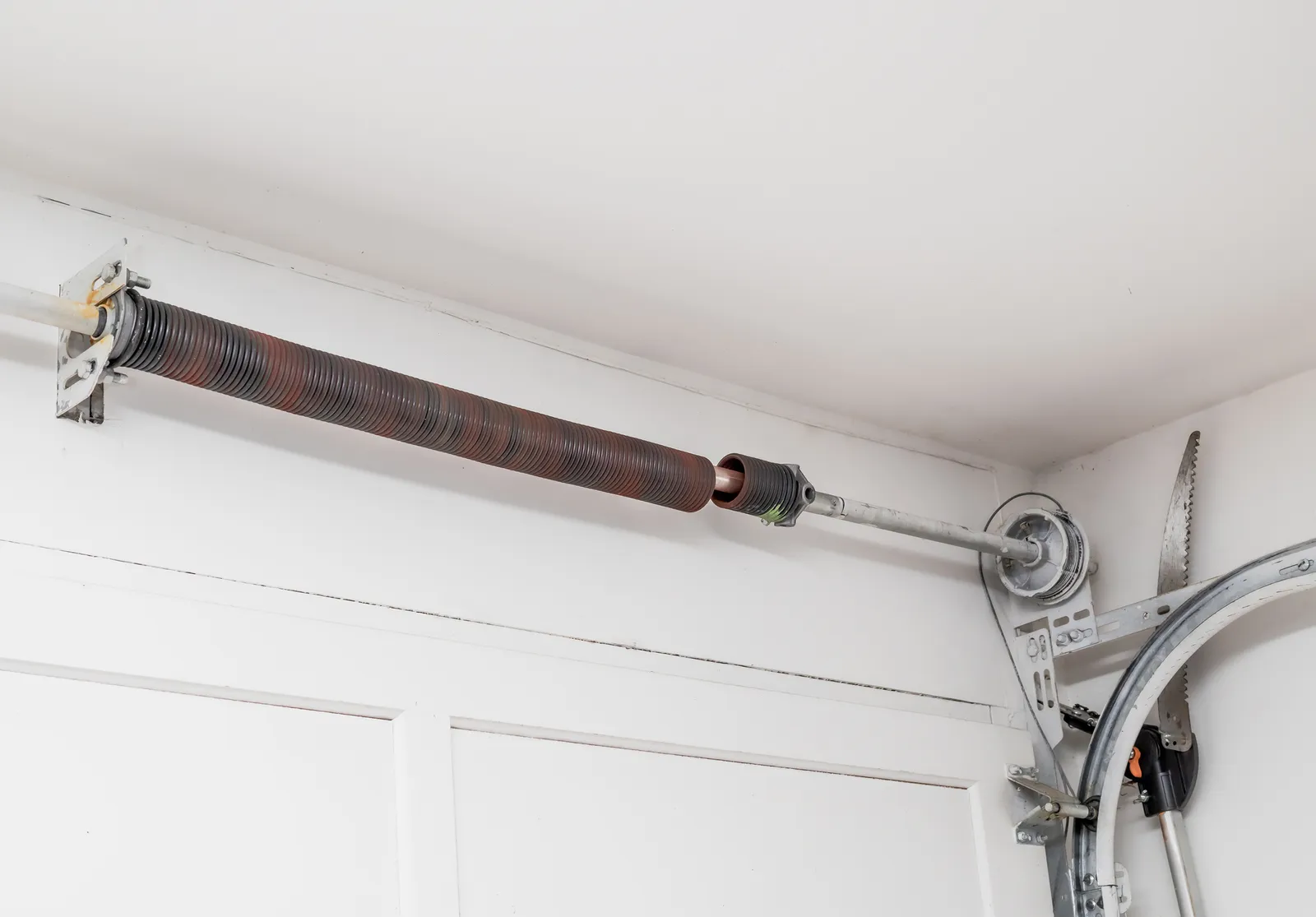 Emergency garage door repair for a broken torsion spring after hours