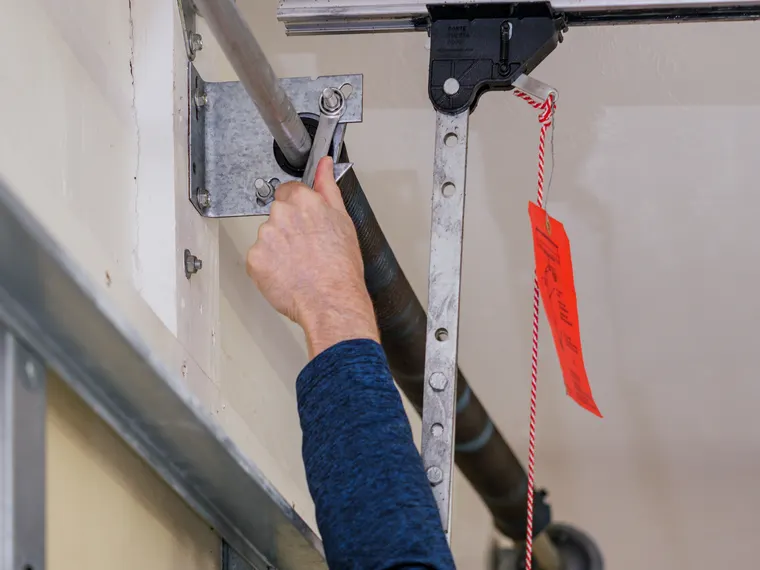 Emergency garage door repair using the red manual release cord in San Diego