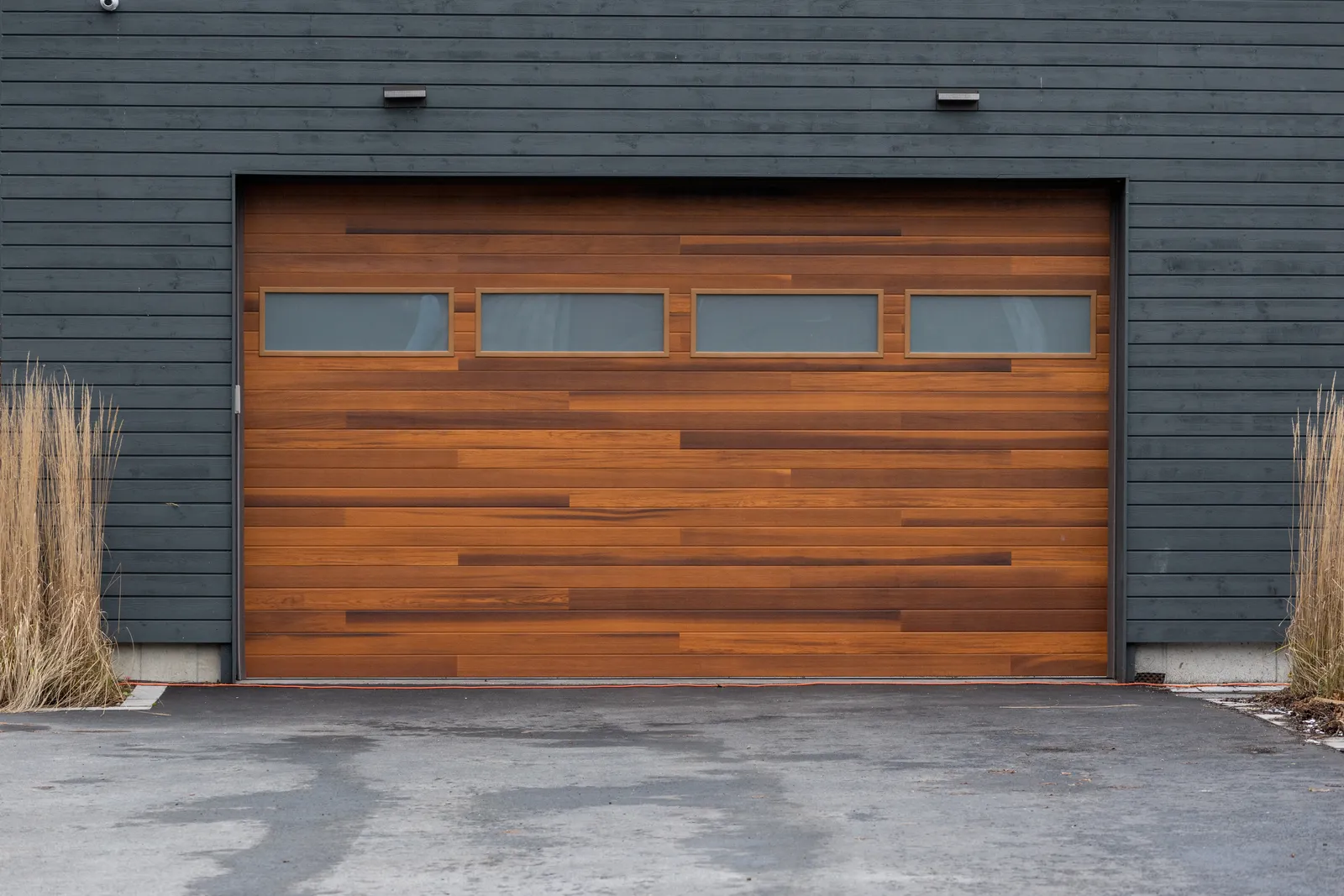 Garage door replacement comparing steel, wood, and aluminum doors