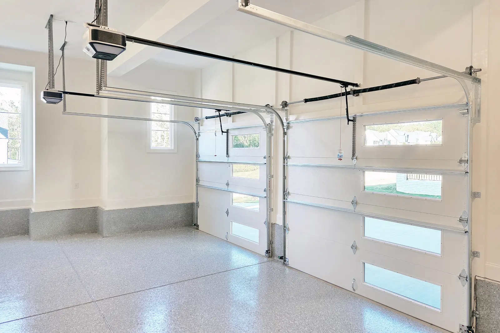 Garage door spring replacement showing single versus double torsion springs