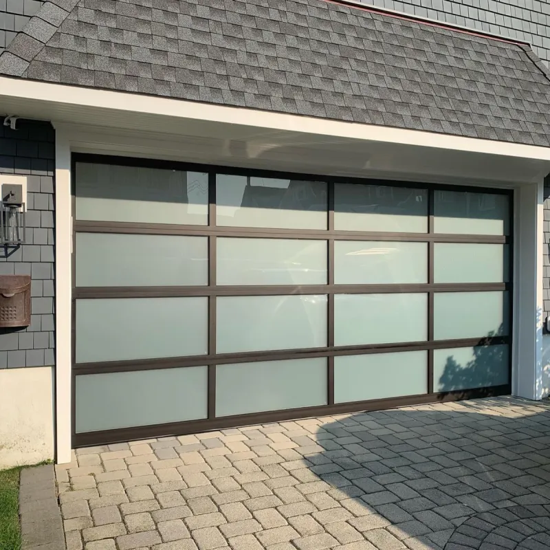 Frosted glass full-view garage door on paver driveway